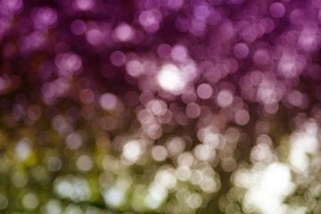 Abstract background. Distribution of white bokeh on a delicate pink background  