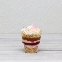 Delicious vanilla dessert with cream cheese, caramel and strawberries for the holiday.