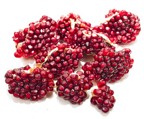 Pieces of pomegranate isolated on a white background.