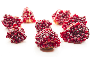 Pieces of pomegranate isolated on a white background.