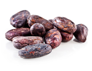 Cacao beans isolated on a white background.