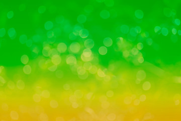 Abstract background. Distribution of white bokeh on a delicate green background  
