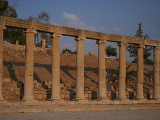 Fototapeta premium Pillars of roman ruins in the historic city of Jerash, Jordan, landscape of constructions build with columns