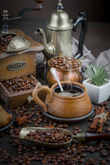 Coffee in a cup and saucer on an old background.