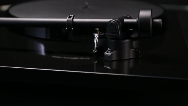 Close-up shot on turntable tonearm.