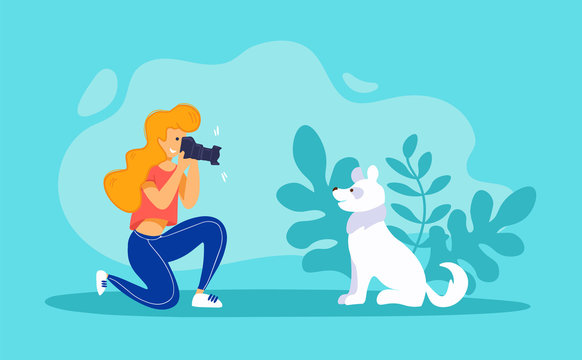 Pet photographer taking photo of a dog. Young woman with digital camera and funny white puppy. 