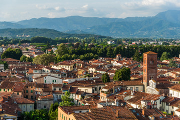Fototapeta na wymiar View at traditional ancient Italian town with colorful houses in Tuscany from above