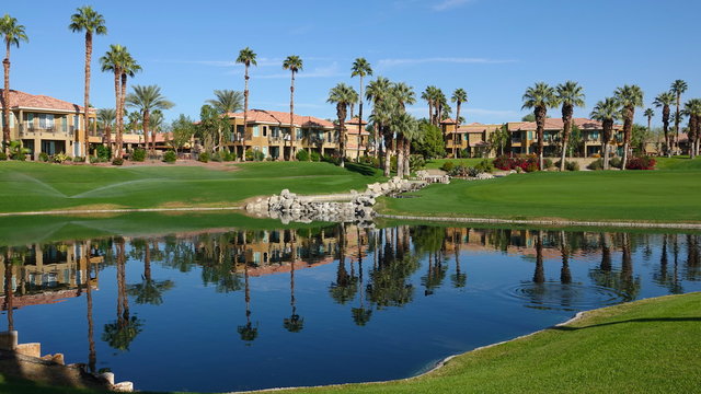 The Villas at the JW Marriott Desert Springs Resort seen across a golf course water feature. Photo taken in Palm Desert, CA / USA on November 14, 2019.
