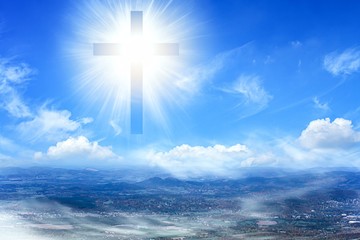 Easter background .    Christian cross against the sky oss . Easter background .    Christian...