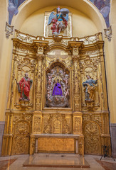 ZARAGOZA, SPAIN - MARCH 3, 2018: The polychome carved broque side altar in church  Iglesia de San Miguel de los Navarros.