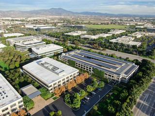 Aerial view of business and finance district with new office building surrounded by parking and road. Irvine Business Complex. Irvine California. USA