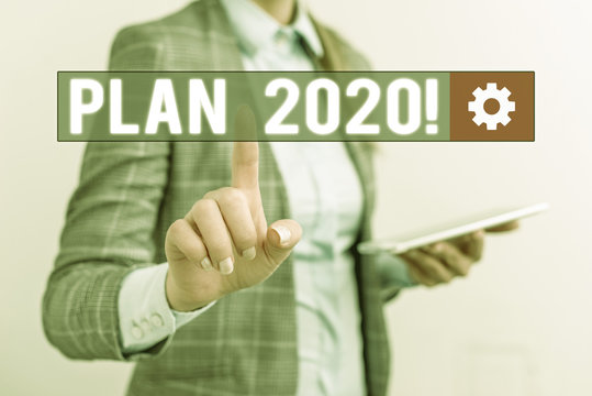 Conceptual hand writing showing Plan 2020. Concept meaning detailed proposal doing achieving something next year Business concept with mobile phone and business woman
