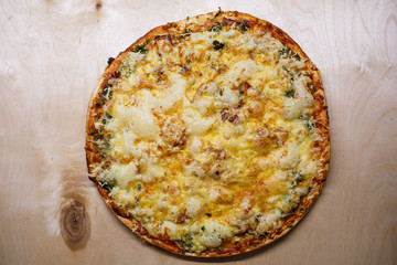 Home cooked pizza on a wooden board
