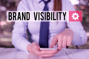 Conceptual hand writing showing Brand Visibility. Concept meaning frequency at which showing see...