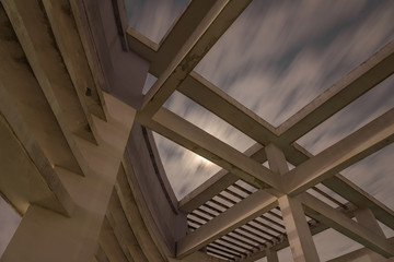 Crossing structure of concrete pillars and beams on the roof under moonlight