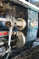 Bangkok,Thailand-December 5, 2019: Driving wheels and coupling rods on a steam locomotive made in Japan