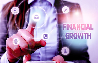 Conceptual hand writing showing Financial Growth. Concept meaning increase in finances of an...