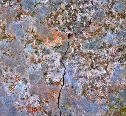 A cracked rock surface, natural mineral backgrounds and backdrops material.