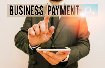 Writing note showing Business Payment. Business concept for trade of value from one party to another for goods Male human wear formal work suit hold smartphone using hand