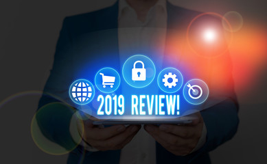 Text sign showing 2019 Review. Business photo showcasing remembering past year events main actions or good shows