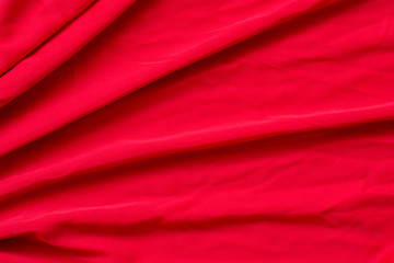 Fototapeta na wymiar Beautiful red fabric is suitable for making backgrounds in various concept designs in the top view.