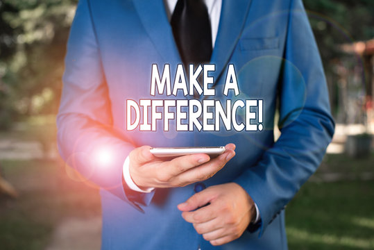 Conceptual hand writing showing Make A Difference. Concept meaning have significant effect or non on demonstrating or situation Businessman in blue suite stands with mobile phone in hands