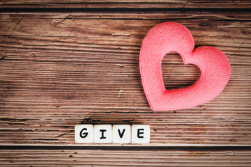 Give love with pink heart for donate and philanthropy health care love organ donation family insurance and CSR concept world heart day world health day Concepts of sharing giving or valentines day