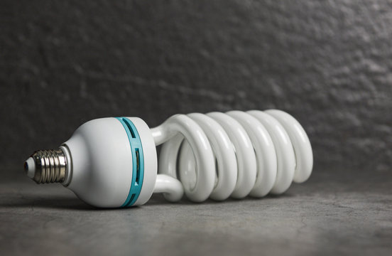 light bulb led , light from the lamp on dark background / energy saving idea , power saving