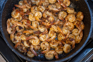 Delicious fried shrimp in a pan
