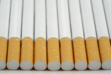 several cigarettes stacked on table