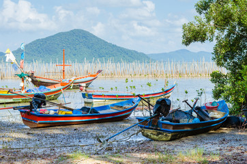 Obraz premium Wood Fishing Boat is Parking On The Beach.