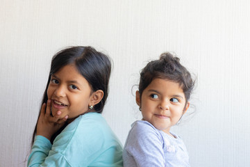 Two little girls looking at each other