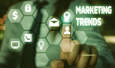 Conceptual hand writing showing Marketing Trends. Concept meaning changes and developments in...