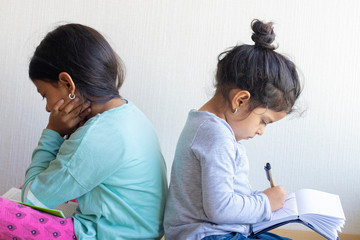 Two girls studying together