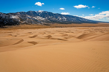Sand Dunes Leading to the Mountains