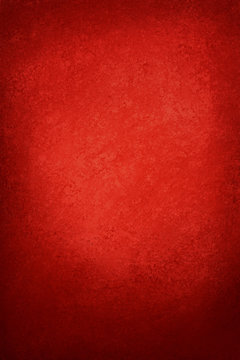 Red Christmas or valentines day background color in solid red with old vintage grunge texture and black vignette frame