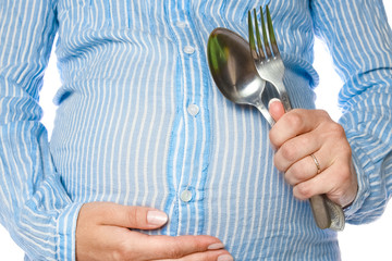 Happy pregnant girl lies on white background