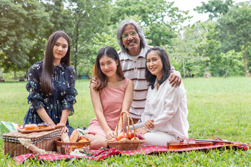 Happy family fun together in the garden in summer.