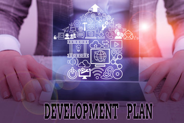 Conceptual hand writing showing Development Plan. Concept meaning the planning of the development...