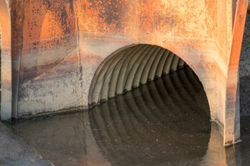 old rusty drainage ditch culvert 