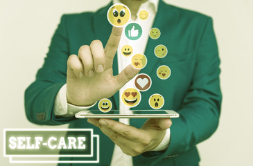 Writing note showing Self Care. Business concept for the practice of taking action to improve one s...