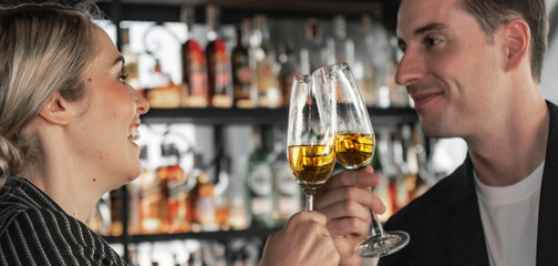 caucasian business people toasting glass of wine together in business party