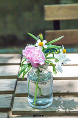 Beautiful flower arrangement in glass vase on the table