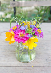 Beautiful flower arrangement in glass vase on the table