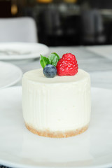 Round fresh cheesecake with strawberry and blueberry 