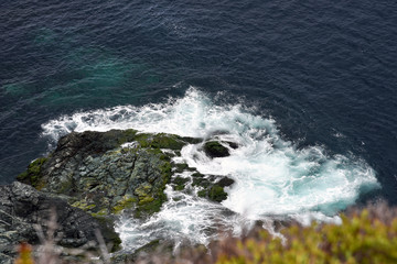 Water from Atlantic Ocean crashing against the coast of Newfoundland, Canada