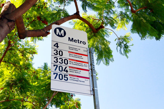 West Hollywood, California - October 11, 2019: LA Metro Bus Stop sign on Santa Monica Blvd, West Hollywood