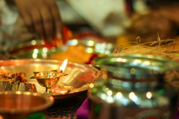 Traditional indian wedding ceremony in Hinduism : puja thali and oil lamp 