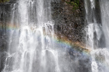 Beautiful rainbow in the paradise waterfall on the big island