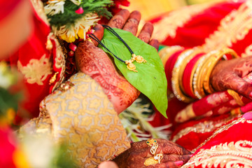 Mangasutra  holding in groom hand 